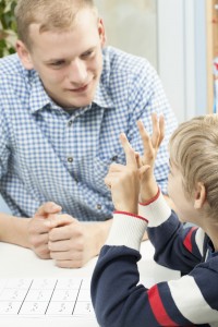 tutor helping child with homework