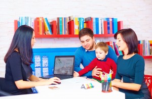 PCIT Psychologist helping family with family stress in group session. 