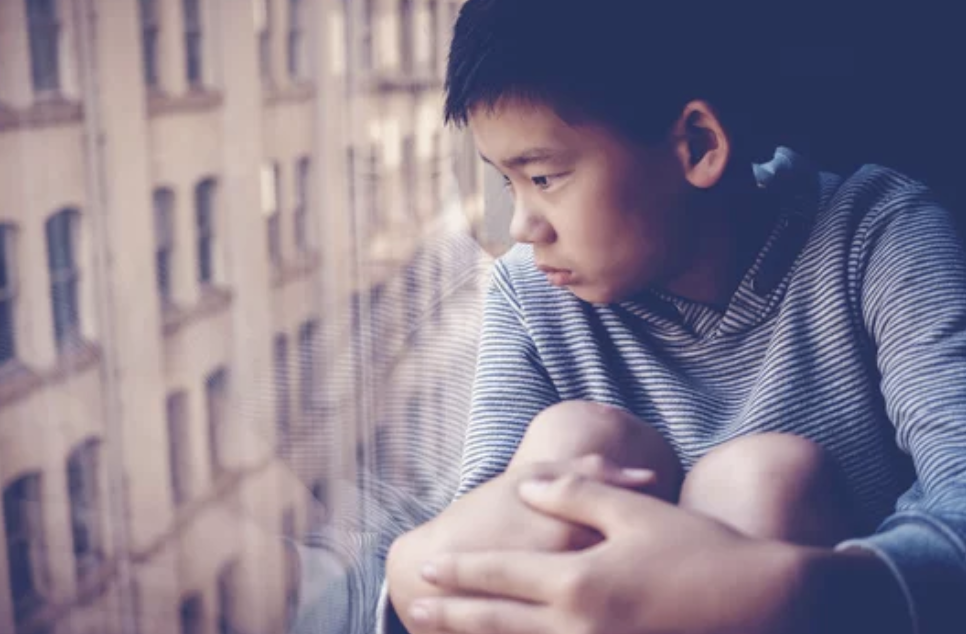 teen with Social Anxiety Disorder looking out a window