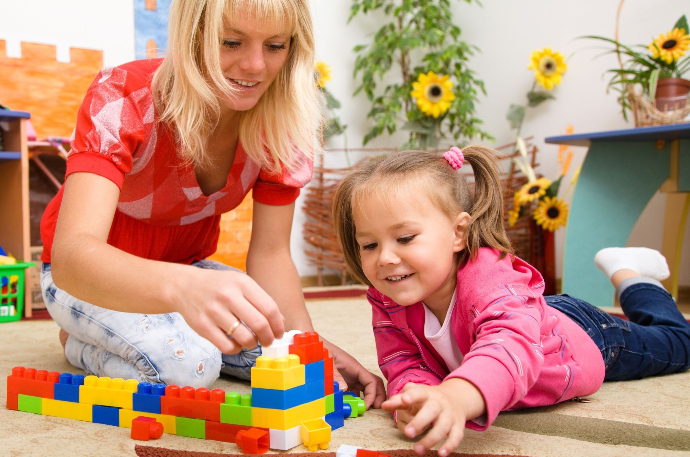 Child Psychologist playing activity with little girl in (PCIT) session