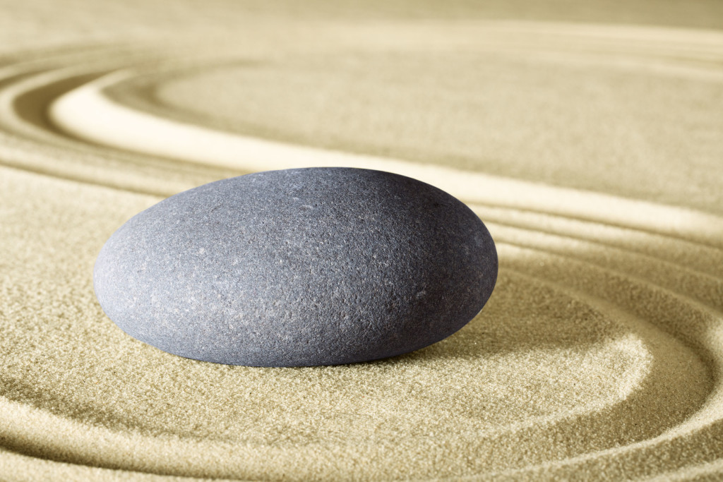 smooth rock on top of smooth sand.