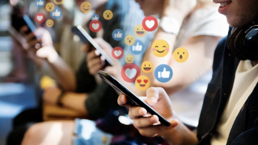 passengers on a subway using social media on their smartphones