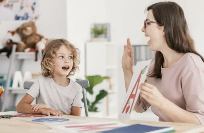 Mother practicing with child for success at home with child.