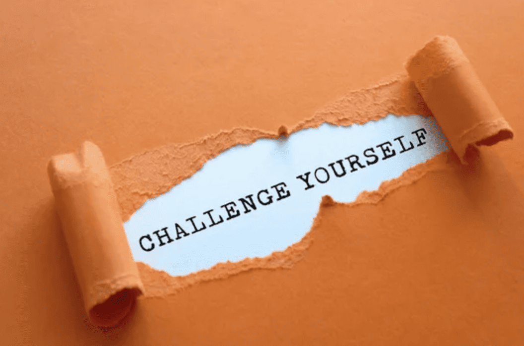 Paper tear background with words "Challenge yourself".