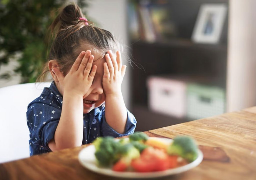 Little girl picky eater refusing to eat her food